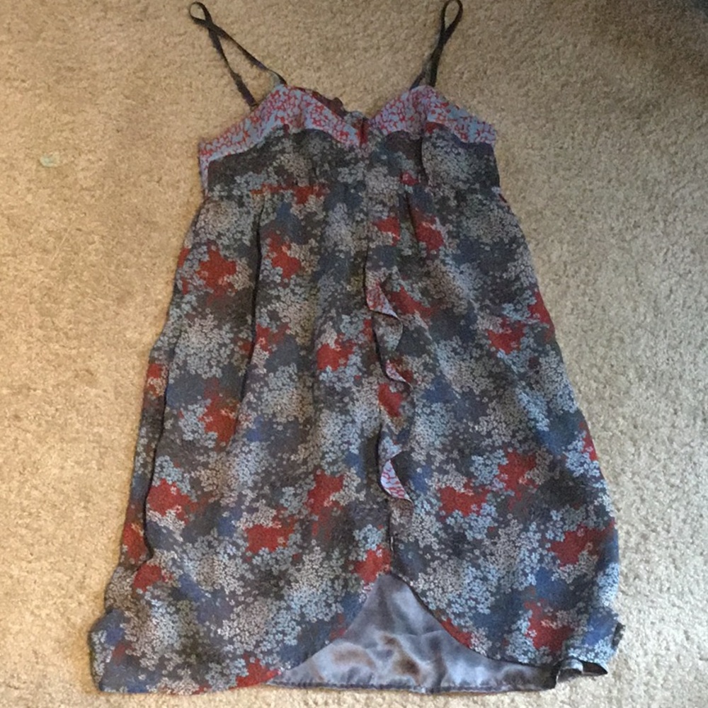 Grey shirt with white blue and red designs